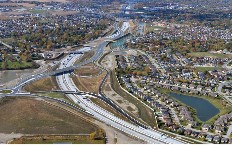 Aerial view of the highway as it passes through a city